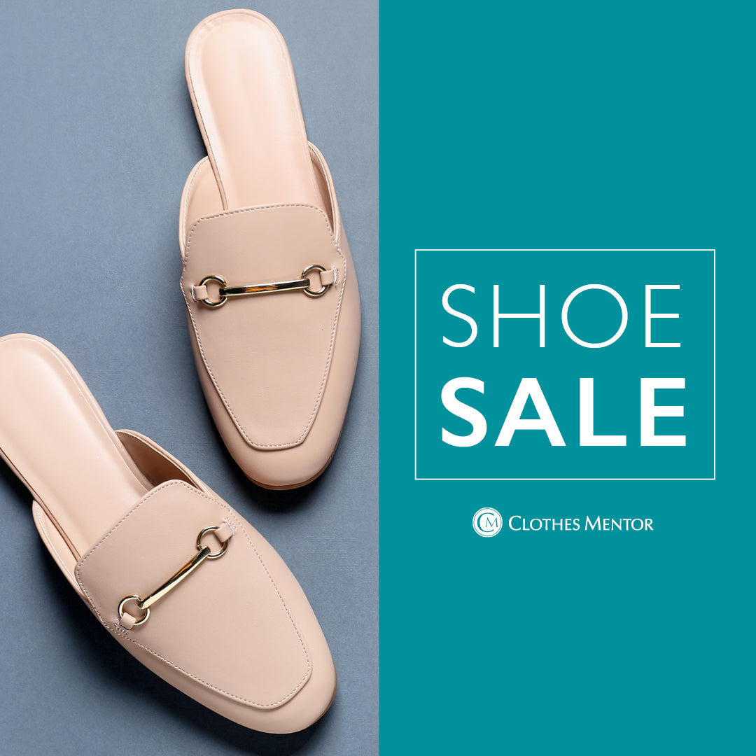 A pair of nude beige leather mule loafers with gold-tone horsebit details, displayed on a split background with a solid teal panel on the right containing the text 'SHOE SALE' and the brand name 'CLOTHES MENTOR'.