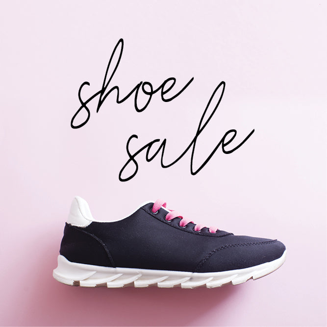 Navy sneaker with pink laces on a pink background with 'shoe sale' text